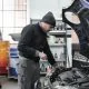 auto mechanic inspecting car engine in repair shop.jpg 80x80